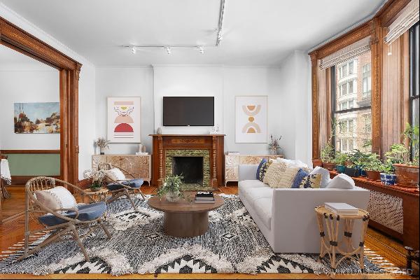 <div>This Upper West Side three-bedroom, two-bath gem features beautifully restored woodwo