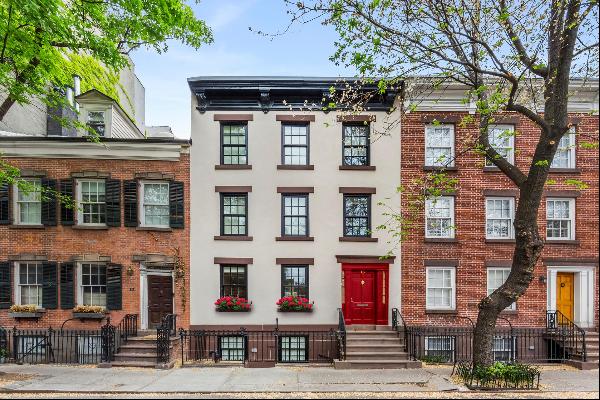 Located on the most charming winding street in the historic West Village, this enchanting 