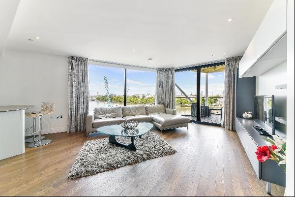 A spacious three bedroom apartment is available to let in Riverlight Quay, London SW11.