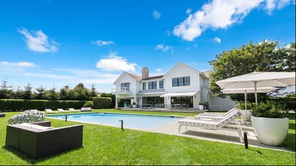 Stunning two-story home that embodies the elegant and timeless style of the Hamptons. It b