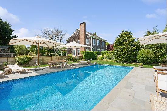 Summer in the Hamptons in style. This four-bedroom four bath retreat comes complete with a