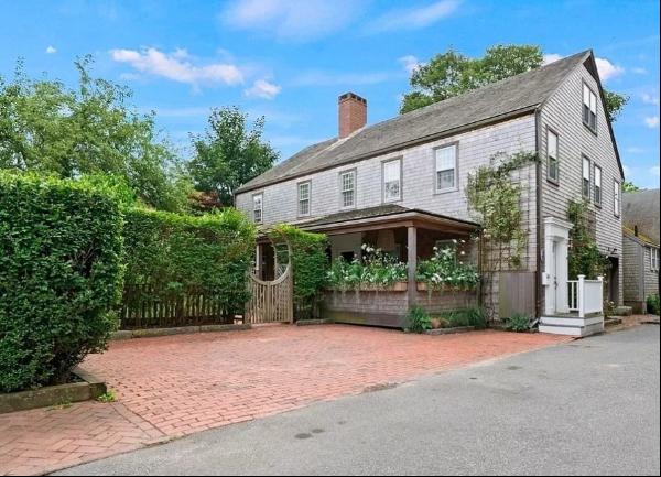 RATE IS WEEKLY- Embrace the charm of an idyllic Nantucket home set less than one-half of a