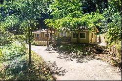 Dual Living Paradise: Two Homes, Travel Trailer, and Workshop on 1.2 Acres