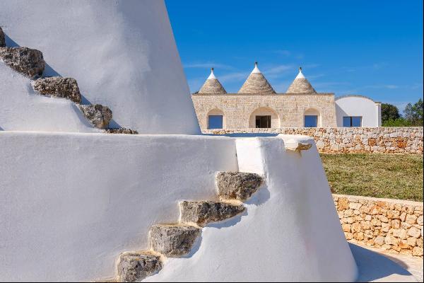 Bright lamia with trulli in the Itria Valley