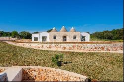 Bright lamia with trulli in the Itria Valley