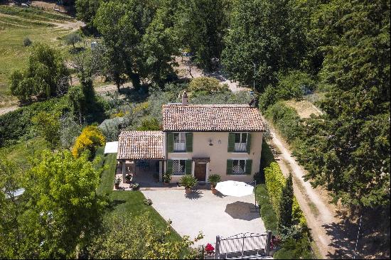 Villa with blooming garden nestled in an elegant valley