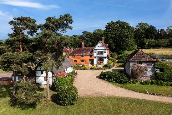 An exceptionally charming manor house and detached three bedroom cottage surrounded by bea