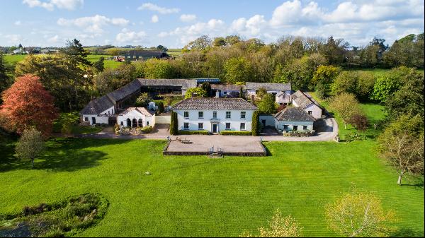 A gorgeous south-facing country home sat in just over 7 acres, offering a perfect blend of