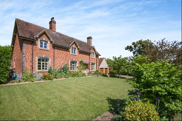 A charming detached period home surrounded by delightful cottage gardens all within easy c