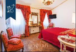 Elegant estate in a historical building, currently housing a hotel, for sale in Lucca