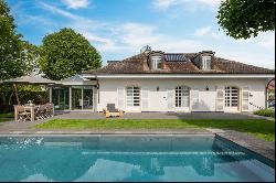 Detached house with pool nestled in greenery