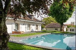 Detached house with pool nestled in greenery