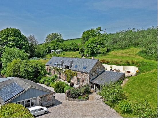 A beautifully crafted contemporary home with 4.48 acres on the edge of the popular village