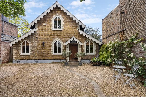 A remarkable opportunity to acquire this detached coach house with gated driveway and deli