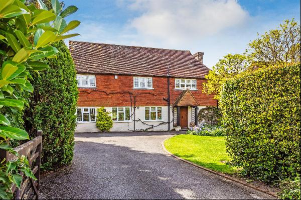 A wonderful family house in a superb location in the heart of this prime Surrey village wi