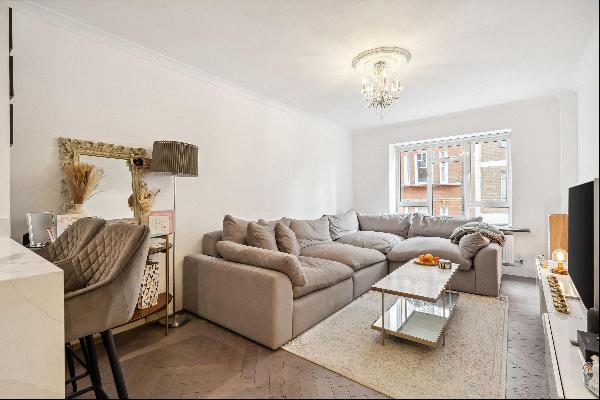 A beautifully presented apartment situated on the first floor of a purpose-built, portered