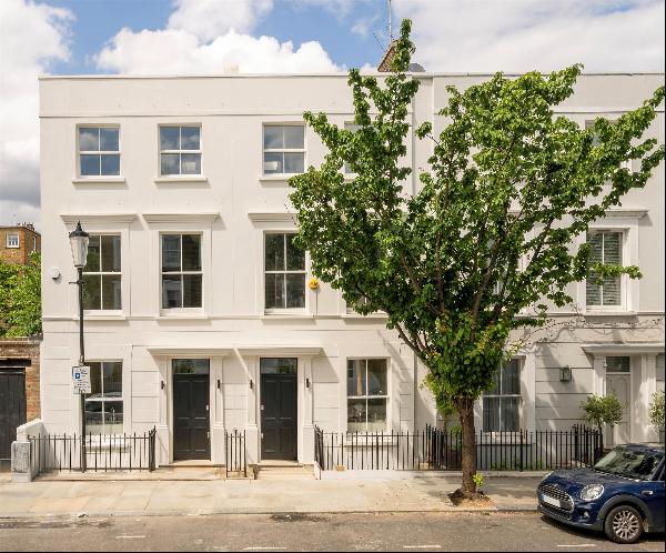 A flawlessly executed four-bedroom townhouse For Sale in Holland Park, featuring inspiring