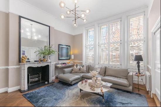 An elegant three bedroom, two-bathroom duplex apartment for sale in Harrington Gardens SW7