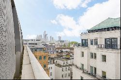An immaculately finished three-bedroom apartment with far-reaching views