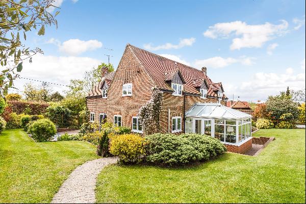 A well-presented family house with paddocks and stabling.