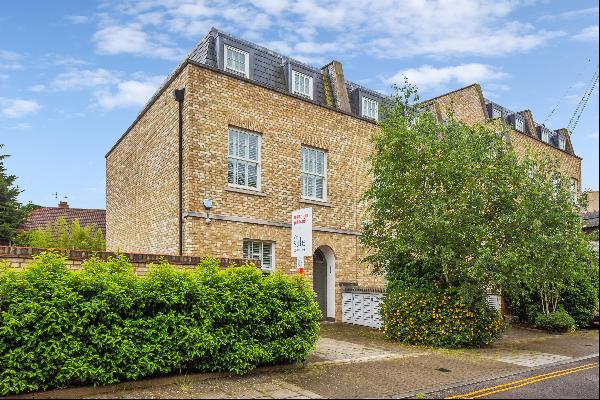 A Spacious Five-Bedroom, Three-Bathroom, Freehold Family Home with a Private West-Facing G