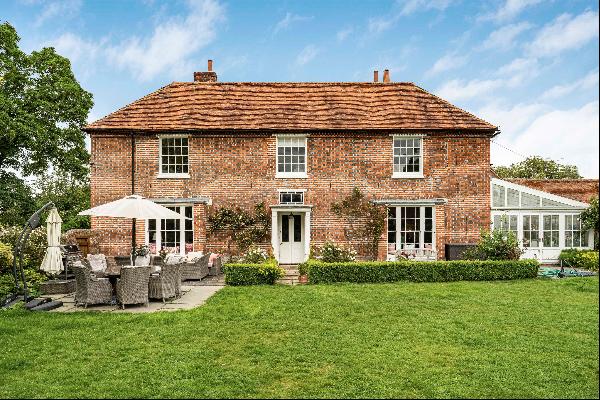 A former manor house with a separate cottage in a most sought-after village