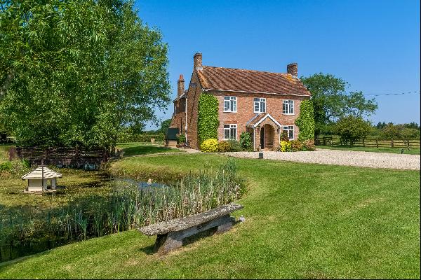 A beautiful family home, with gardens, grounds and stables.