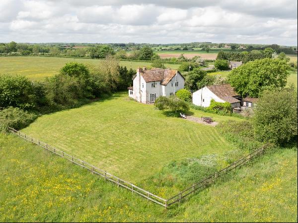 A spacious Edwardian country home with versatile outbuilding and good access to national c