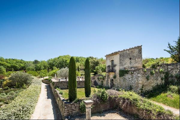 A charming property with gites, a swimming pool and land for sale.