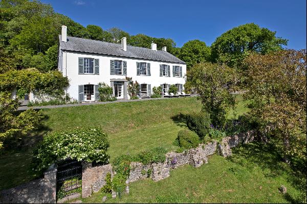A mini estate is set in beautiful rolling countryside with some views of the sea.