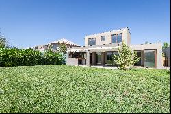 Mediterranean-style house with a terrace featuring an integrated barbecue area.