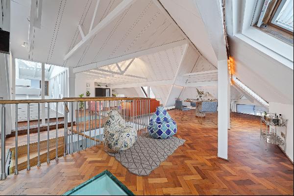 A truly unique four bedroom apartment with access to communal gardens in Hampstead Village