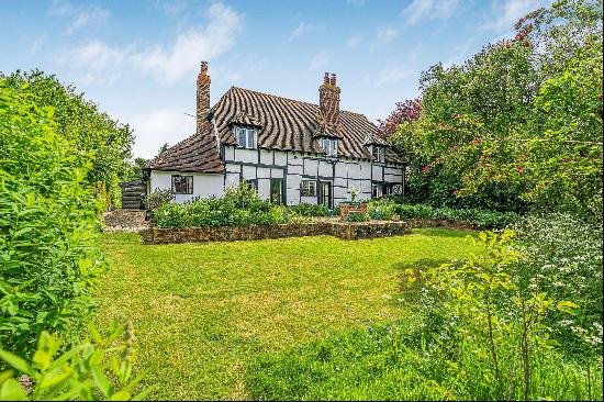 A wonderfully secluded Grade II listed house with large gardens in a small rural hamlet wi