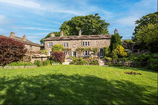 An impressive stone-built Grade II listed period farmhouse set in the Yorkshire Dales Nati