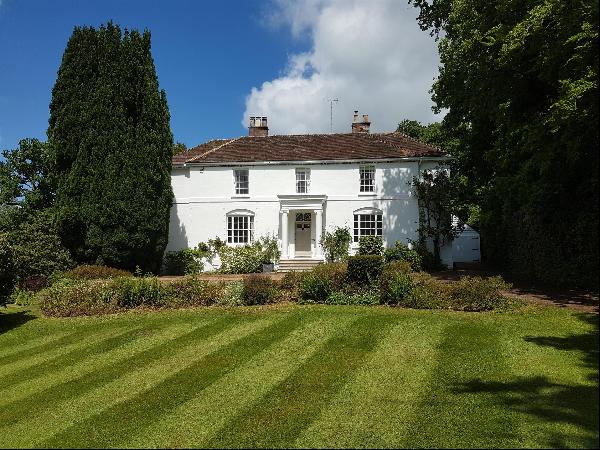 A delightful Grade II listed Georgian country house standing in idyllic gardens and ground