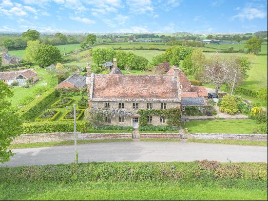 A charming Georgianised 14th century farmhouse set in six acres with an annexe and beautif