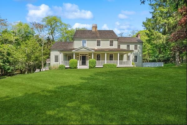 Welcome to 2766 Noyack Road, a custom-built gem nestled on a private road in the heart of 