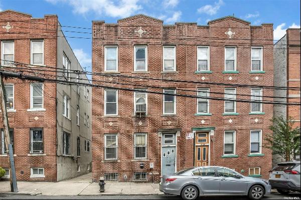 Welcome to this charming brick 3-family home nestled in the heart of Astoria, Queens. As y