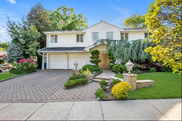 Nestled in the heart of Manhasset Hills and the Herricks School District, this exquisite c