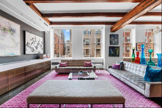 Experience the allure of an authentic pre-war SoHo loft with intricate detailing and mo