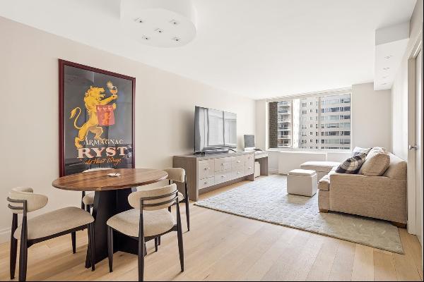 12J is in mint condition as a newly renovated one-bedroom in a full-service condo in Le