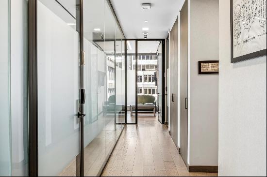 Situated in the heart of Manhattan's renowned Diamond District, the office condominium 