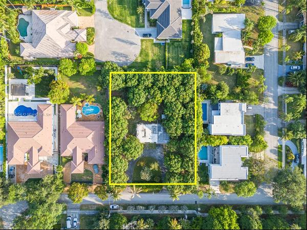 A rare opportunity to acquire prime land in lush Pinecrest. This expansive 8,777 sqft lot 