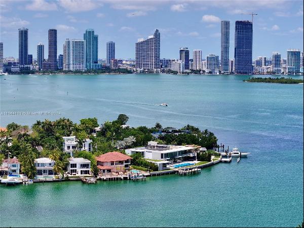 Boasting breathtaking views of Biscayne Bay, this elevated home features six bedrooms and 