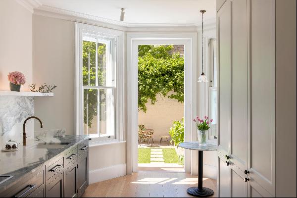 A four bedroom apartment with a private garden for sale in London SW5