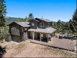 Captivating log home is nestled in the picturesque mountains of Pine, Co.