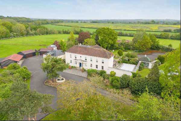 A superb Georgian style home set in approximately 12 acres in Warfield.