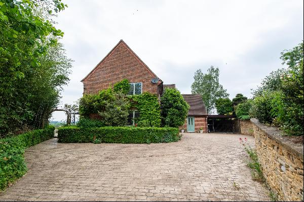 A stunning setting with around 94 acres, house with views to the Cotswolds, long tree-line