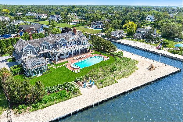 This exquisite bayfront shingle-style residence, meticulously crafted in 2014 by esteemed 