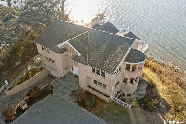 Welcome to an exquisite waterfront estate on Long Island's prestigious Gold Coast, nestled